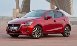Mazda 2: Indicazione principale limitatore di velocità regolabile (Bianca), 
Indicazione
(Bianca)/Indicatore luminoso (Verde) impostazione limitatore di velocità
regolabile - Limitatore di velocità
regolabile* - i-ACTIVSENSE - Al volante - Mazda 2 - Manuale del proprietario